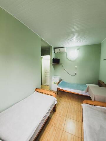 Фото номера Стандартный трехместный номер с видом на море Гостевой дом Ureki House г. Уреки 14