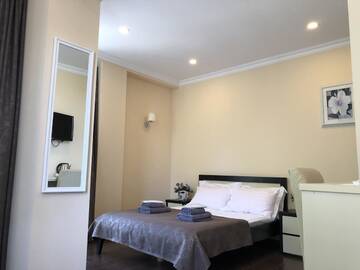 Фото номера Семейный номер Делюкс Отель GNS Hotel г. Уреки 6