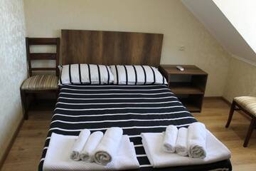 Фото номера Четырехместный номер с ванной Отель Hotel Lion г. Уреки 6